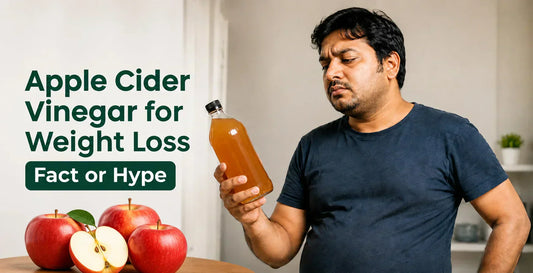 Skeptical overweight man examining apple cider vinegar bottle beside fresh red apples questioning if ACV works for weight loss