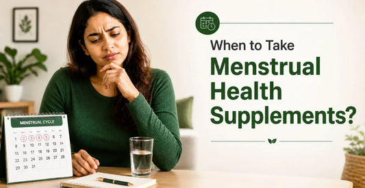 Thoughtful woman looking at menstrual cycle calendar with water glass on table wondering when to take menstrual health supplements