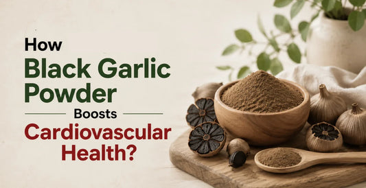 Wooden bowl of black garlic powder with whole black garlic cloves and spoon on cutting board to boost cardiovascular health