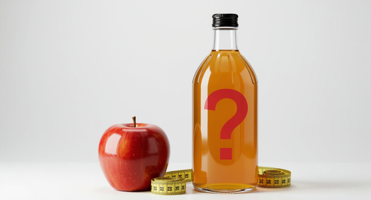 Apple cider vinegar bottle with a question mark, next to an apple and a measuring tape.