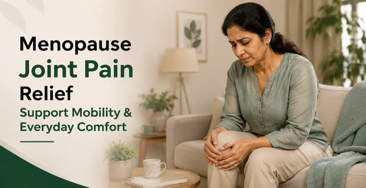 Woman in discomfort gripping knee at home - best supplements for menopause joint pain relief, improving mobility and reducing daily joint discomfort.