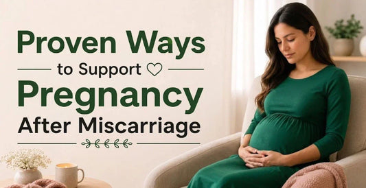 Pregnant woman in green dress gently cradling baby bump on sofa representing proven ways to support pregnancy after miscarriage