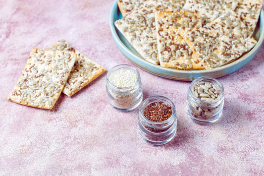 Psyllium husk seed crackers with flax and sunflower seeds for natural constipation relief and digestive health.
