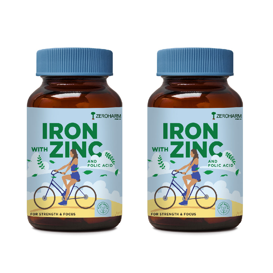 two glass bottles of iron supplement tablets